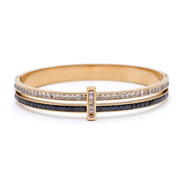 Nemesacél, fekete-fehér köves, arany színű merev karkötő, kb. 17 cm