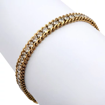 Nemesacél, középen végig köves, arany színű karkötő, kb. 17-21 cm