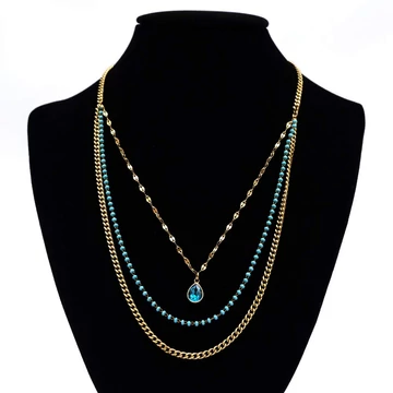 Nemesacél nyaklánc arany színű, 3 soros, kék gyönggyel és kővel lánchosszabbítóval, 39+5 cm