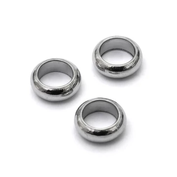 Nemesacél kerek köztes dísz, 6mm, 4,5 mm lyuk (10 db)
