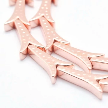 Hematit (rosegold) fecskefarok köztes dísz, 15.5x8x3 mm (3 db)