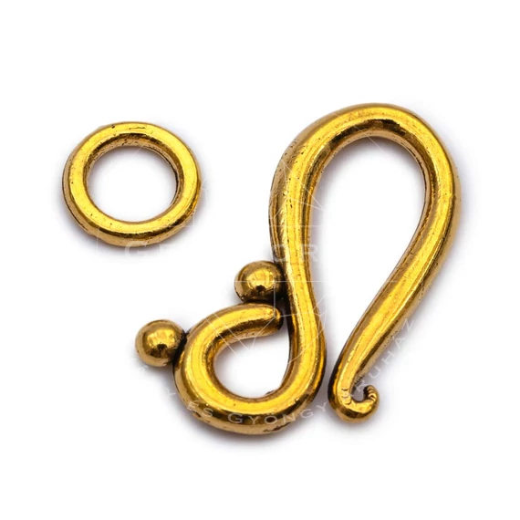 Kapocs, hurkos forma, antik arany színű kb. 20x12 mm (1db)