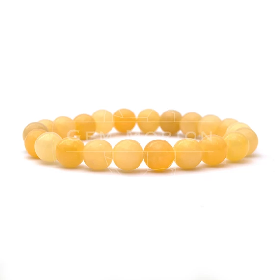 Narancskalcit gumis ásvány karkötő, 8 mm