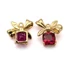 Elegáns ajándékdoboz, piros kővel, 18K bevont arany masnis medál, kb.15x14 mm (1 db)