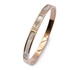 Nemesacél, kagylós és köves rosegold színű merev karkötő, kb. 17 cm